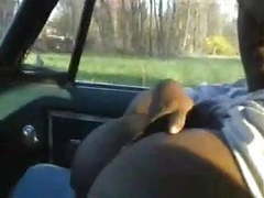 KiloPics.net presents: Black bbw with big tits sucking dick in a car.