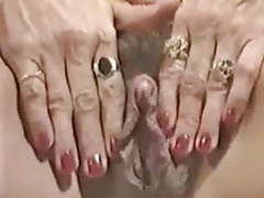 KiloPics.net presents: Milf plays with her big clit