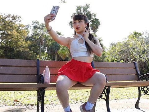 KiloPics.net presents: Gorgeous solo college babe doing striptease in a park - pixie