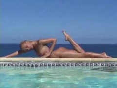 KiloPics.net presents: Blonde strips from bikini and takes a dip