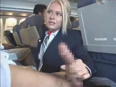 KiloPics.net presents: Stewardess gives a handy j on plane