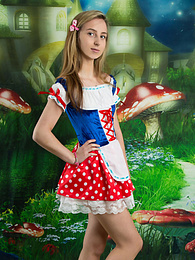 KiloPics.net presents: Very hot blonde teen beauty in an adorable outfit slowly takes it off to reveal her nice and perky boobs