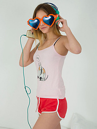 KiloPics.net presents: This doll really knows how to have fun with her and how she can show off her pussy and listen to some beats at the same time.