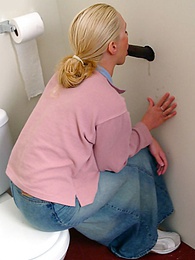 KiloPics.net presents: Blonde girl Jamie sits on the toilet and blows a black gloryhole dong