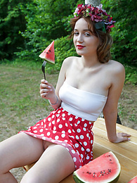 KiloPics.net presents: Nice belarusian stunner Rokki removes all clothes on a blanket in a backyard